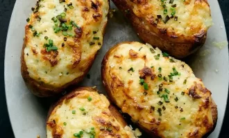 Learn how to make Twice-Baked Garlic Potatoes with crisp potato skins.