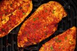Juicy air fryer chicken breast served with herbs and lemon