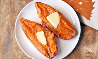 Microwaved sweet potato halves with melted butter