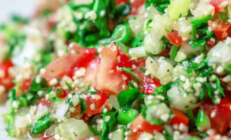 Fresh vegetable tabbouleh salad with herbs and tomatoes